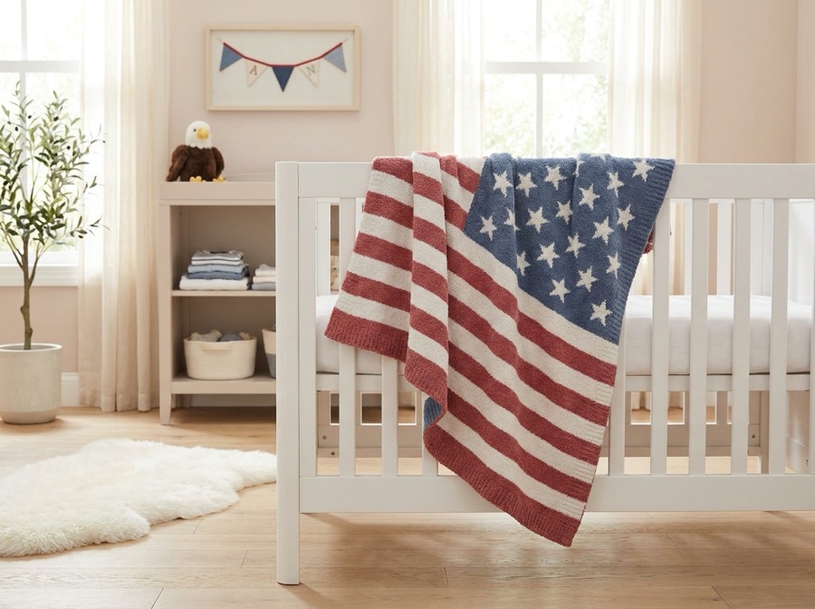 Stars and stripes baby blanket on a crib